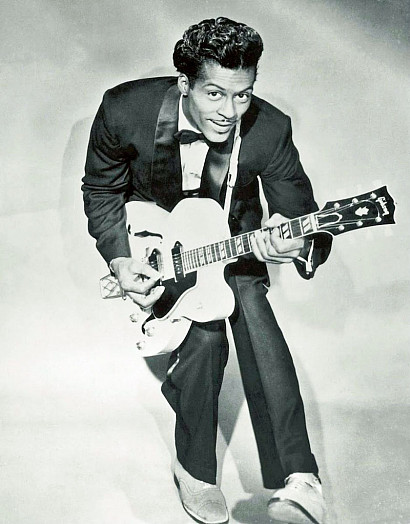 Chuck Berry performing the 'duck walk' in 1955. Original source: Music History Calendar, calendar.songfacts.com/september/8/4062.